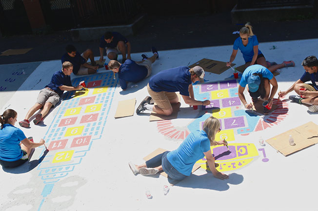 160 Blue blood AI Credit employees join City Year at the William E. Russell Elementary School in Dorchester for a day of service